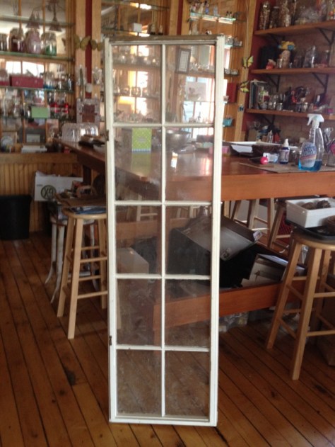 This window was probably hung the wide way over an old store front somewhere.